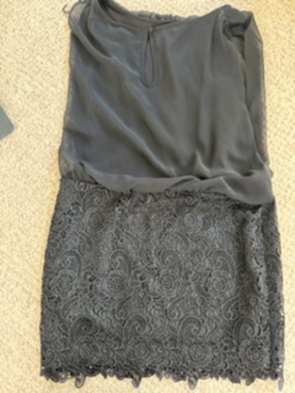 Black sleeveless cocktail mini dress with blouson top